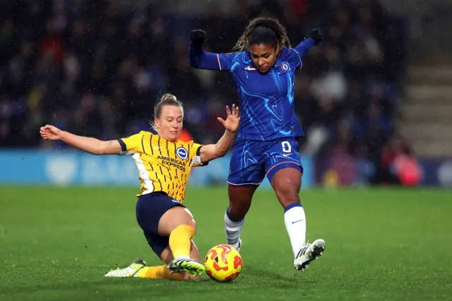 Brighton and Hove Albion's Rachel McLauchlan and Chelsea's Catarina Macario battle for the ball