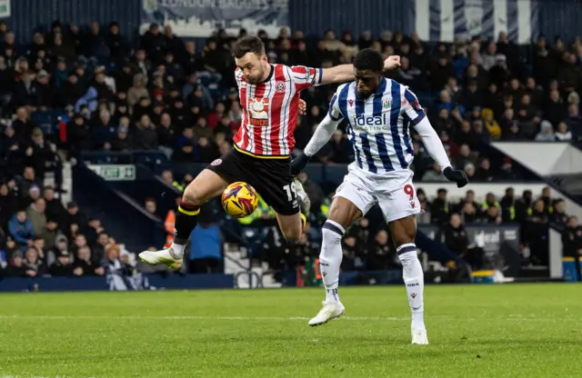 West Bromwich Albion's Josh Maja (right) competing with Sheffield United's Jack Robinson