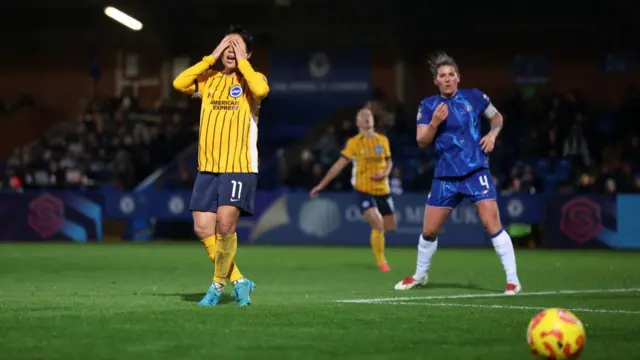 Kiko Seike of Brighton & Hove Albion reacts