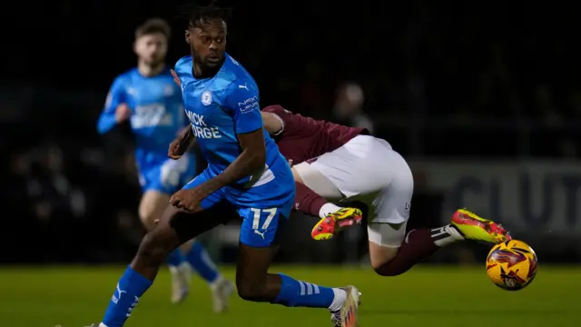 Peterborough's Ricky-Jade Jones sends a Northampton player to the floor