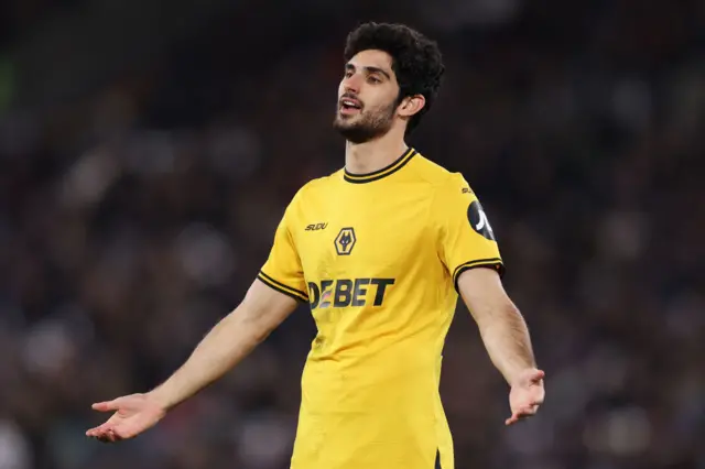 Goncalo Guedes of Wolverhampton Wanderers reacts after a challenge by Emerson Palmieri