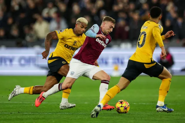 West Ham United's Jarrod Bowen fights for the ball with Wolverhampton Wanderers' Mario Lemina