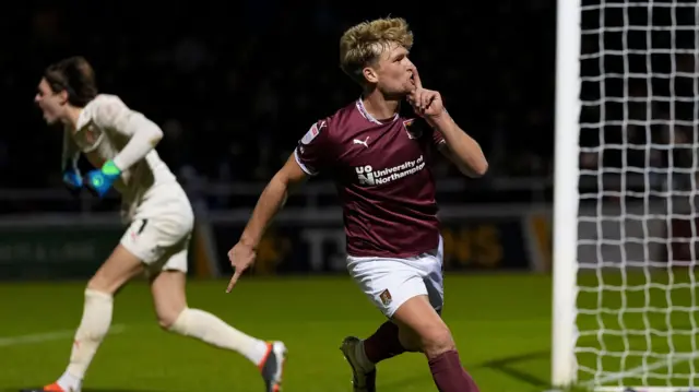 Cameron McGeehan celebrates scoring for Northampton