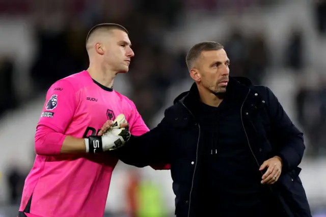 Sam Johnstone of Wolverhampton Wanderers shakes hands with Gary O'Neil