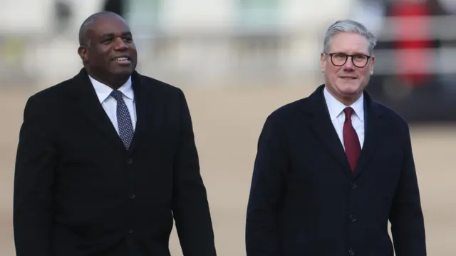 British Foreign Secretary David Lammy (L) and Britain's Prime Minister Keir Starmer depart a ceremonial welcome held at Horseguards Parade during a Qatari state visit in London, Britain, 03 December 2024