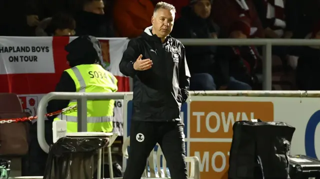 Peterborough United manager Darren Ferguson gestures from the touchline