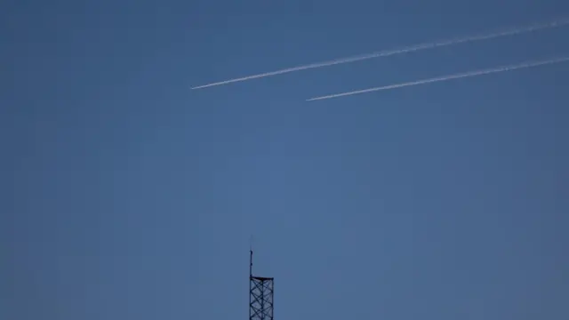 Streaks in the sky which are Israeli planes flying over Syria, as seen from the Israeli-occupied Golan Heights.