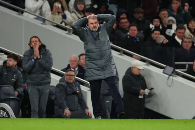 Ange Postecoglou with his hands on his head