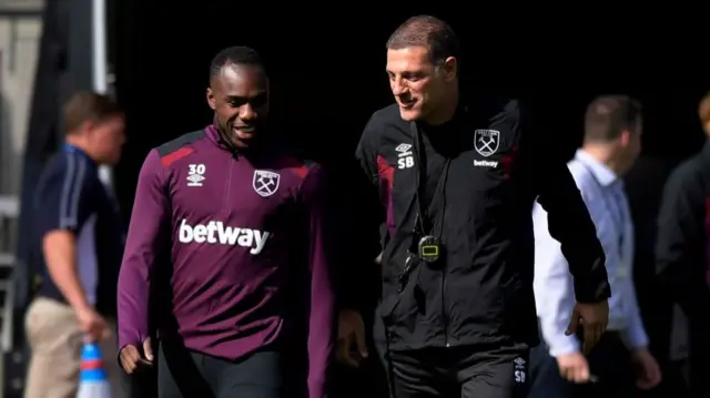 Michail Antonio chats with Slaven Bilic