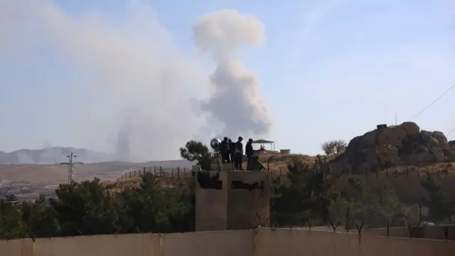 Smoke billows following an Israeli airstrike near Sednaya prison.