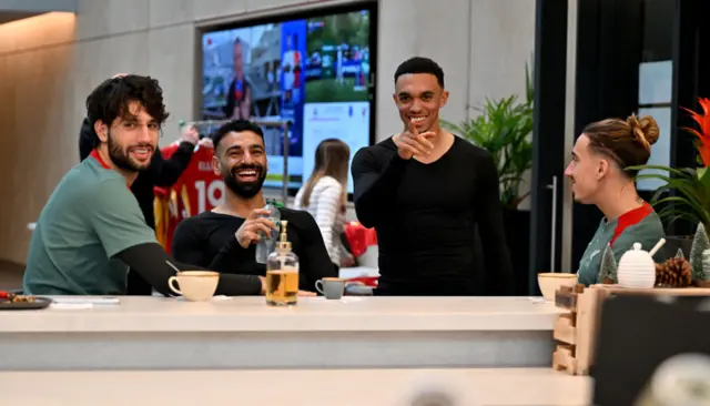 Mohamed Salah and Trent Alexander Arnold relax at the Liverpool training base