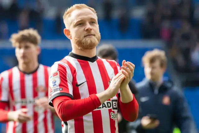 Alex Pritchard applauds fans while playing for Sunderland