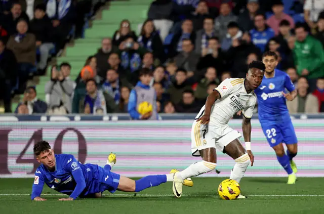 Vinicius Junior vies with Getafe's Spanish forward #18 Jose Carmona