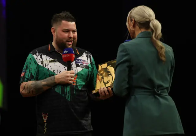 Michael Smith with the trophy