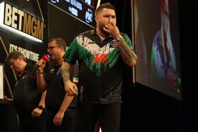 Michael Smith celebrates