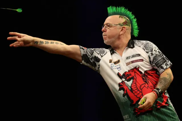 Peter Wright in Welsh dragon shirt