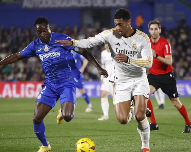 Getafe's Djene in action with Real Madrid's Jude Bellingham