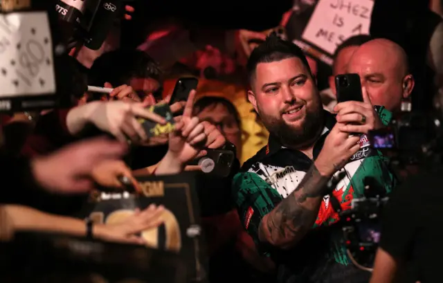 Michael Smith takes a selfie with the crowd