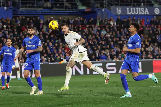 Joselu eyes the ball