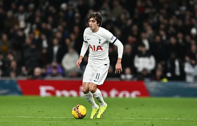 Bryan Gil of Tottenham Hotspur controls the ball