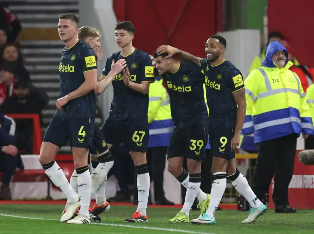 Guimaraes is congratulated on his opening goal by his teammates