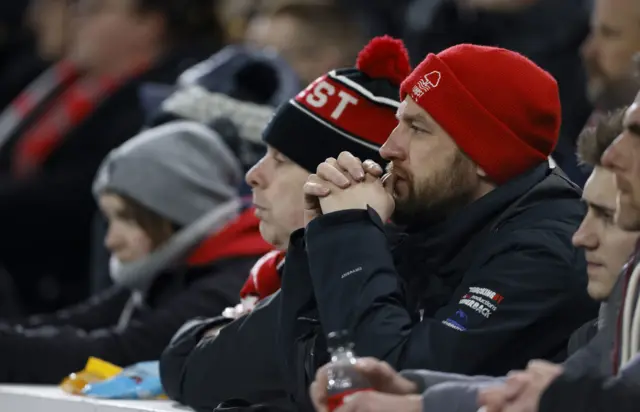 A Forest fan bites his fingernails nervously as he watches on.