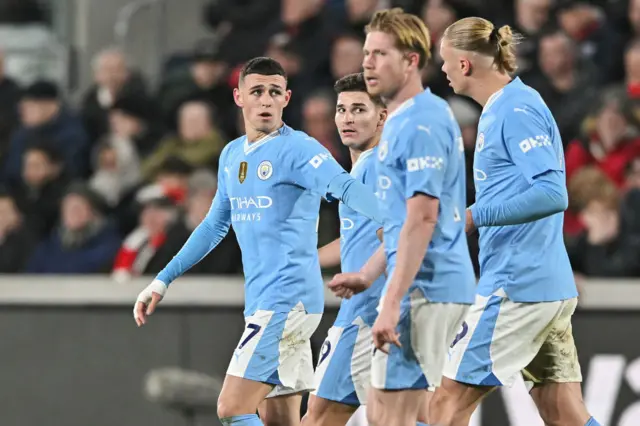 Man City players celebrate Foden's goal v Brentford.