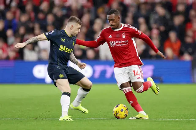 Hudson-Odoi looks to dribble past Trippier on the wing.