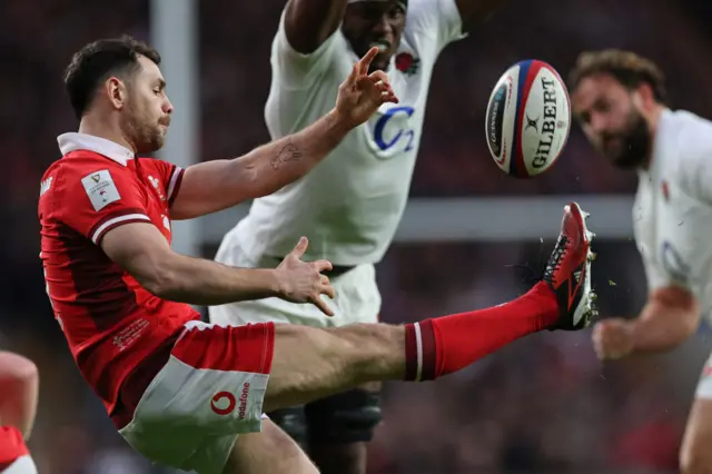 Walsh player kicking the ball