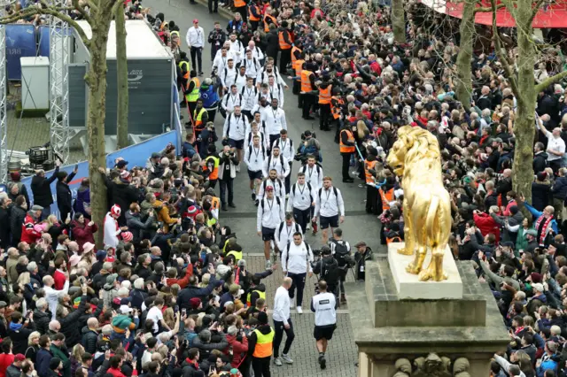 England team walking through the crowds