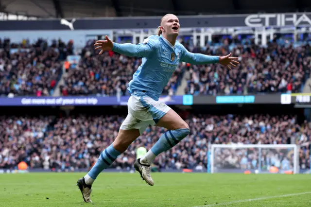 Erling Haaland celebrates after scoring for Man City