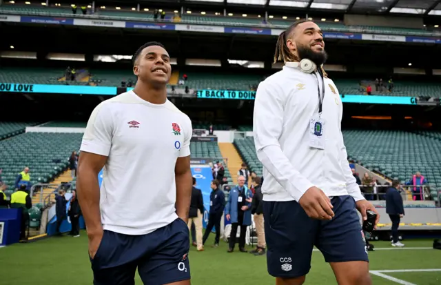 Immanuel Fey-Waboso speaks with Chandler Cunningham-South of England as they walk out of the tunnel to inspect the pitch