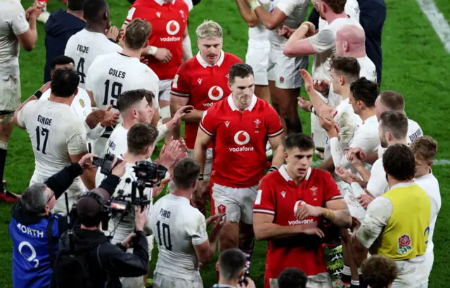 Wales walking through England clapping