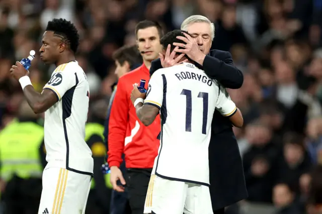 Carlo Ancelotti embracing Rodrygo