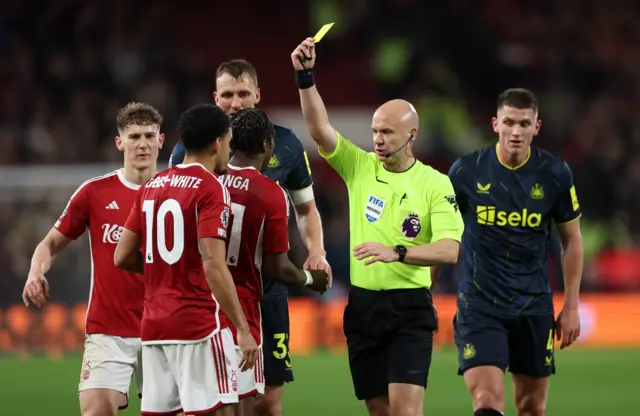 Gibbs-White is booked by the referee.