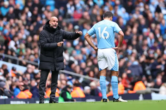 Rodri and Pep Guardiola