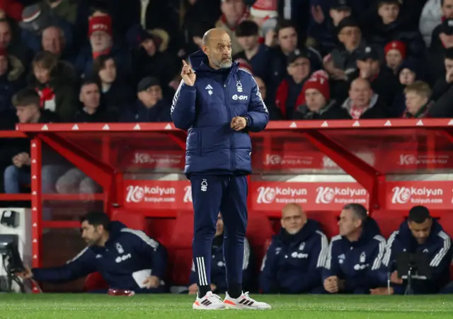 Nuno gestures instructions from the touchline.