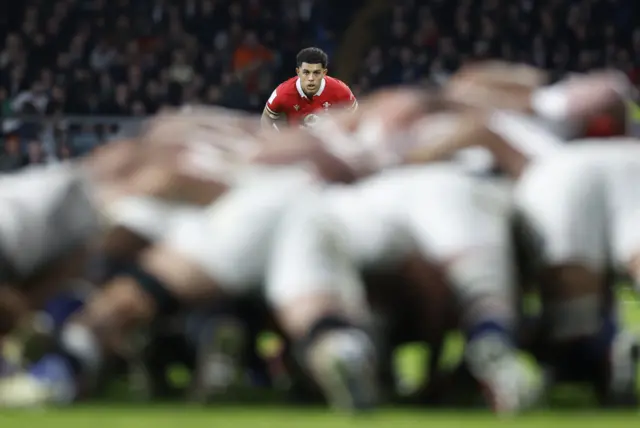 Scrum with England in blue and Wales in view