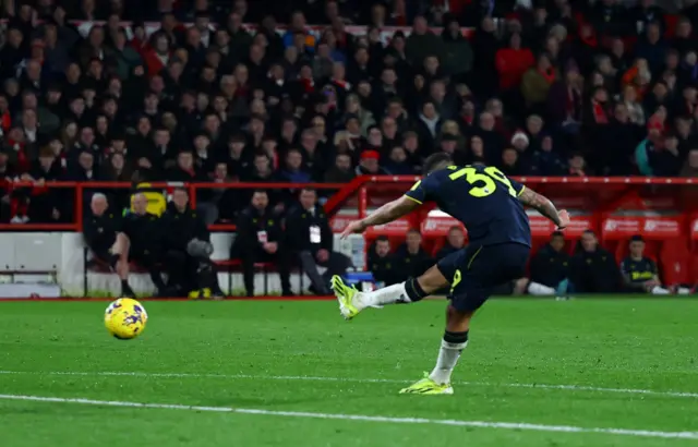 Guimaraes shoots at goal for Newcastle's third goal of the game.