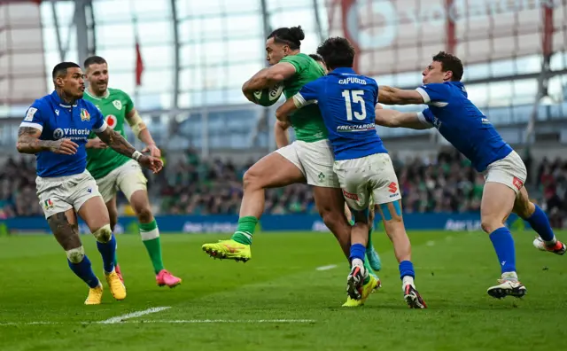 James Lowe is tackled by Ange Capuozzo