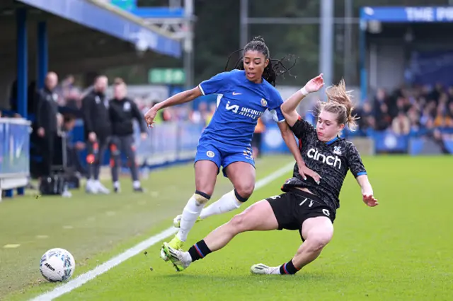 Ashley Lawrence of Chelsea is tackled by Molly Sharp