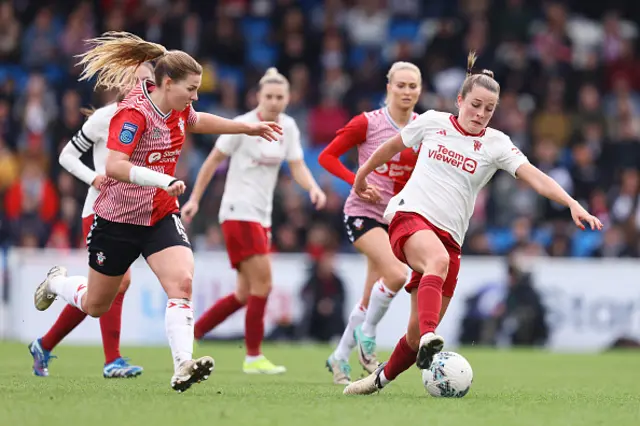 Alice Griffiths of Southampton battles for possession with Ella Toone