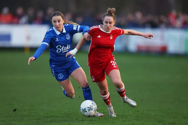 Nat Johnson of Nottingham Forest battles for possession with Clare Wheeler