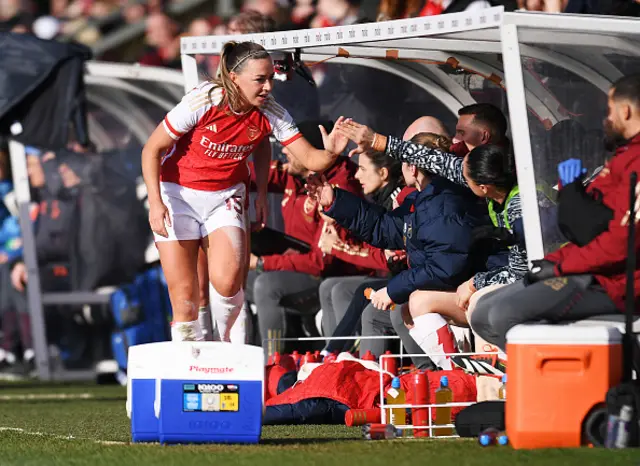 Katie McCabe of Arsenal is substituted off and embraces teammates