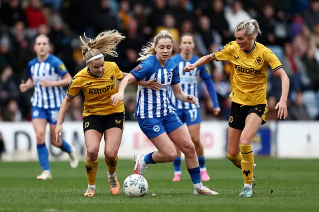 Olivia Fergusson and Tammi George challenge for the ball with Poppy Pattinson