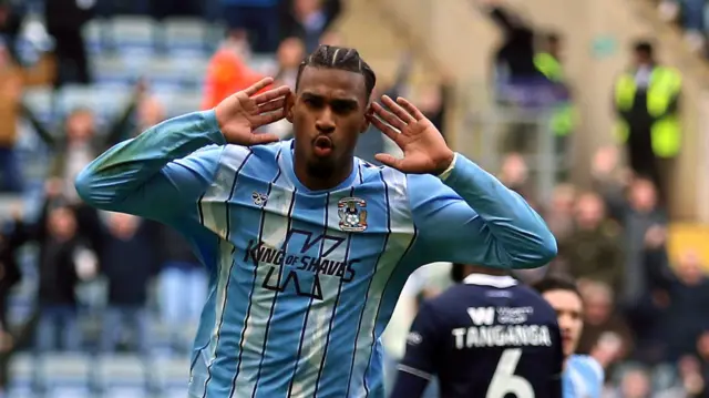 Haji Wright celebrates