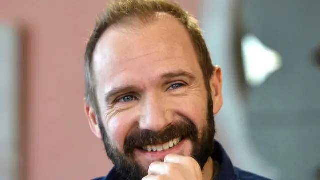 Actor Ralph Fiennes smiles