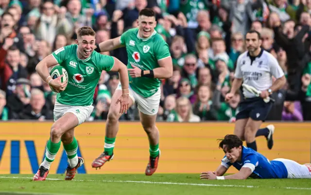 Jack Crowley runs into score Ireland's first try