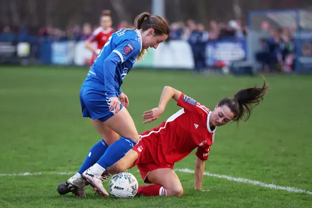 Clare Wheeler of Everton battles for possession with Sophie Domingo