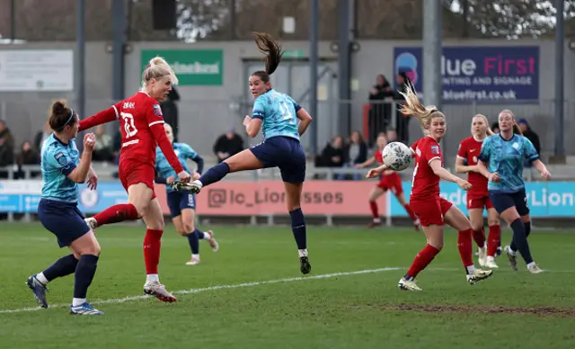 Sophie Roman Haug of Liverpool scores a header